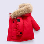 Boys winter coat with hood in red, side view with fluffy hood trim, chest zip, sleeve patch and knit cuff