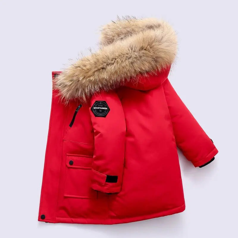 Boys winter coat with hood in red, side view with fluffy hood trim, chest zip, sleeve patch and knit cuff