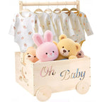 Wooden baby shower gift crate on wheels with clothes rail, Oh Baby cutout, baby outfits on hangers and plush toys inside