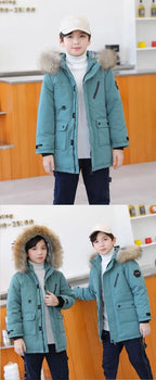 Boys winter coat with hood in teal worn by boys, front views with the fluffy-trim hood down and up