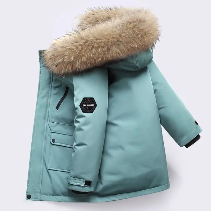 Boys winter coat with hood in teal, side view with fluffy hood trim, sleeve patch and wrist strap
