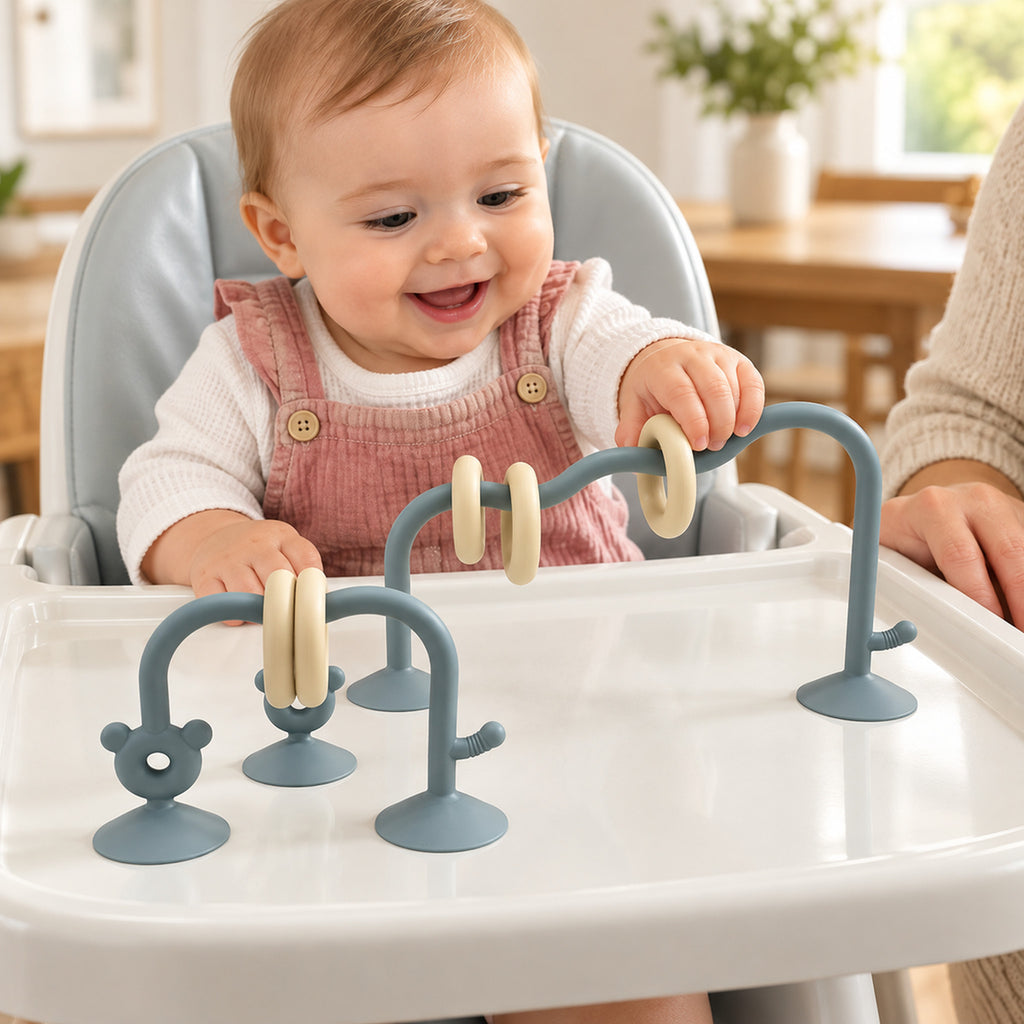 Lumiwee Abacus Suction Cup Toy for High Chairs: baby sliding a ring on the sea blue suction-cup abacus toy with an adult nearby