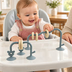 Lumiwee Abacus Suction Cup Toy for High Chairs: baby sliding a ring on the sea blue suction-cup abacus toy with an adult nearby