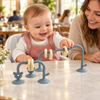 Lumiwee Abacus Suction Cup Toy for High Chairs: baby using the sea blue suction-cup abacus toy at a restaurant table