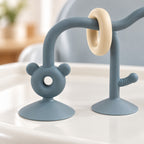 Lumiwee Abacus Suction Cup Toy for High Chairs: close-up of a bear-face suction foot and cream sliding ring