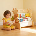 Lumiwee Alder Montessori book rack: giraffe book rack with a girl reading beside it