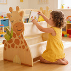 Lumiwee Alder Montessori book rack: girl sliding a book into the sling