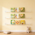 Lumiwee Aspen wall-mounted picture book shelf: three clear book ledges holding picture books on a nursery wall
