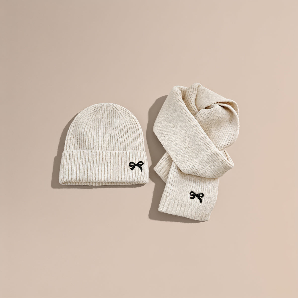 Lumiwee Bow knit kids hat and scarf set: cream knit hat and scarf set on a plain background
