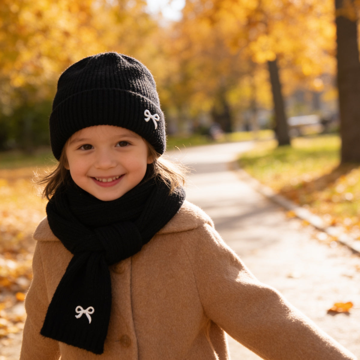 Lumiwee Bow knit kids hat and scarf set, Black option, in a bright room