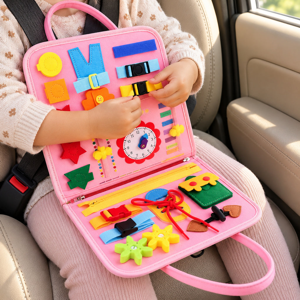 Toddler practicing a buckle on the Lumiwee Bramble busy board during a car ride