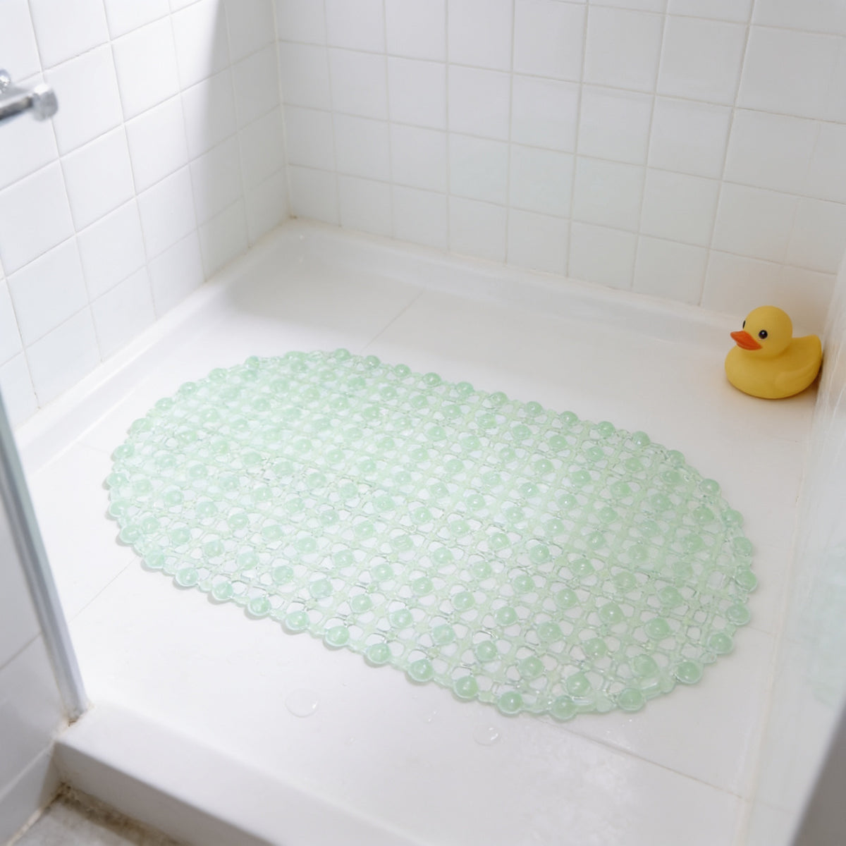 Lumiwee Brook kids suction-cup shower mat, Mint option, in a bright room