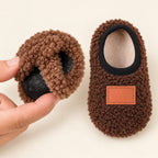 Close-up of the flexible grip sole and plush lining of Lumiwee Burrow slipper socks