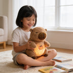 Lumiwee Capy breathing plush: child holding the capybara plush on a rug