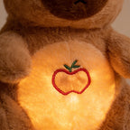 Lumiwee Capy breathing plush: close-up of the glowing belly and apple embroidery