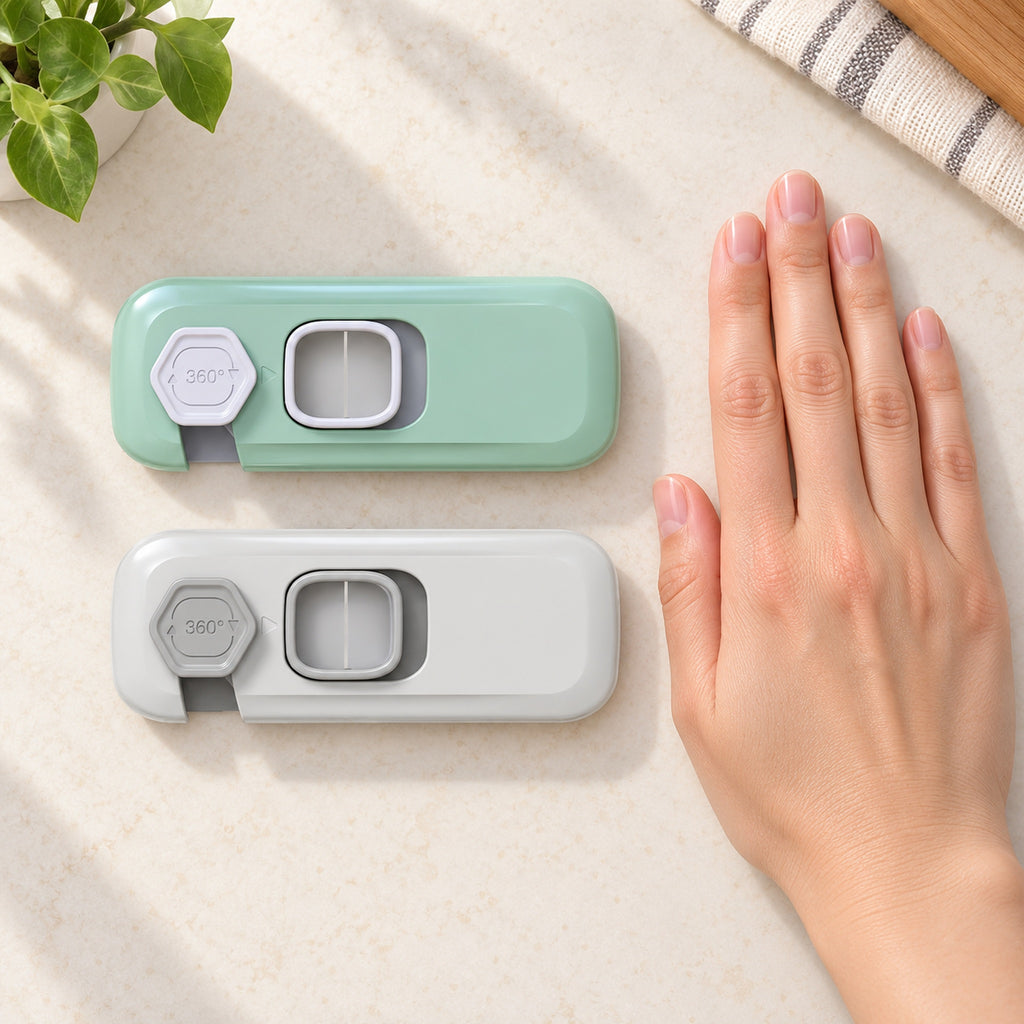 Mint-green and gray Lumiwee fridge locks beside an adult hand for scale