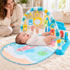 Awake infant kicking the piano on the blue elephant Lumiwee baby gym while a parent supervises