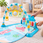 Adult adjusting the piano angle on the blue elephant Lumiwee baby gym