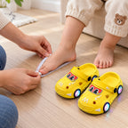 Caregiver measuring a toddler's foot beside yellow Lumiwee car clogs