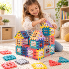 Child building a colorful Lumiwee cottage with chunky interlocking house panels