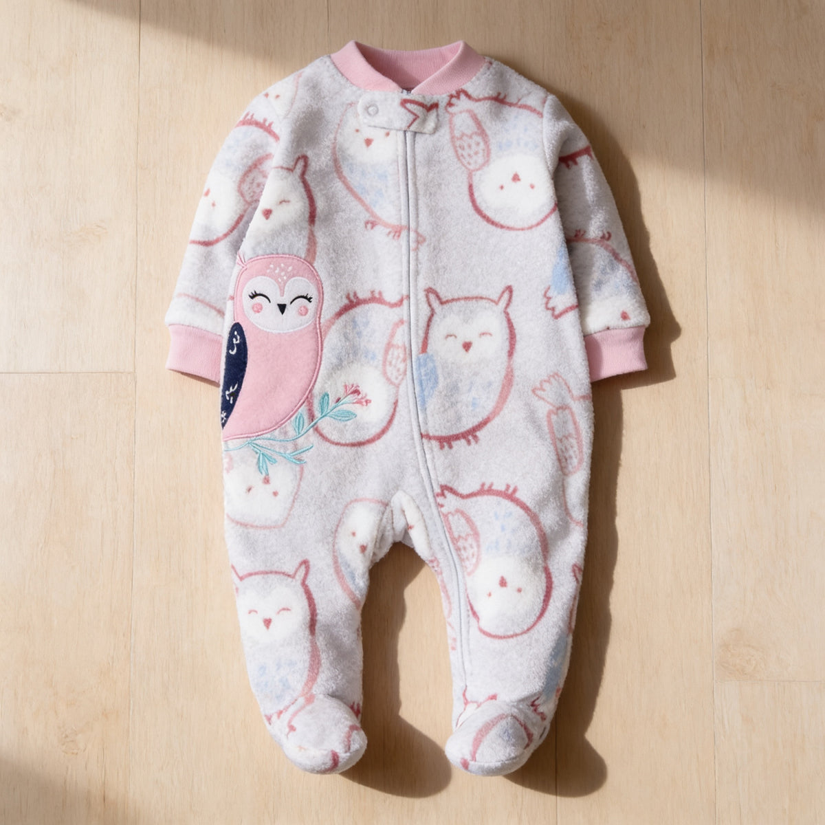 Lumiwee Critter fleece baby romper, Pink Owl option, in a bright room