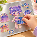Child placing a blue magnetic dress on the purple-haired Lumiwee doll