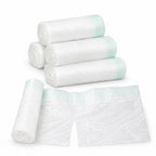 Five rolls of Lumiwee disposable potty liners with one liner opened on a white background