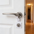 Lumiwee Adhesive door lever lock: white adhesive lever lock fitted under a door lever