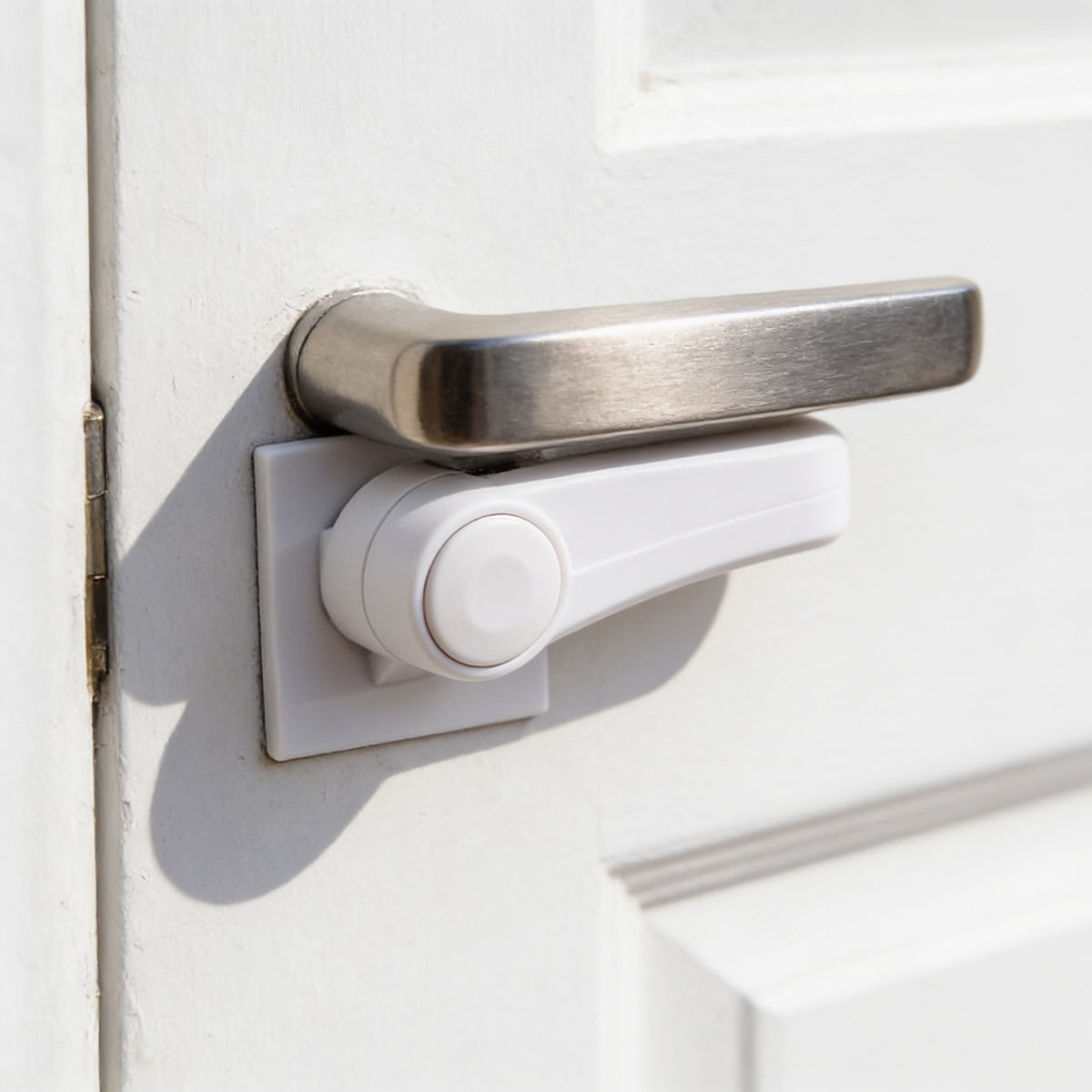 Lumiwee Adhesive door lever lock: close-up of the lock button and rotating arm under the lever