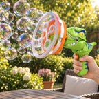 Lumiwee green Fizz dinosaur bubble gun held by an adult outdoors with soap bubbles