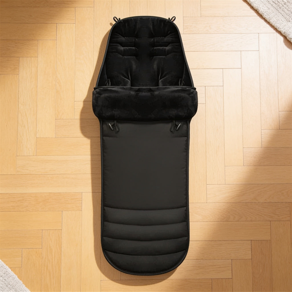 Lumiwee Flurry winter stroller bunting bag: the bunting bag laid flat, showing the harness slots, cuff and quilted foot