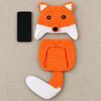 Lumiwee fox photo outfit beside a smartphone for scale