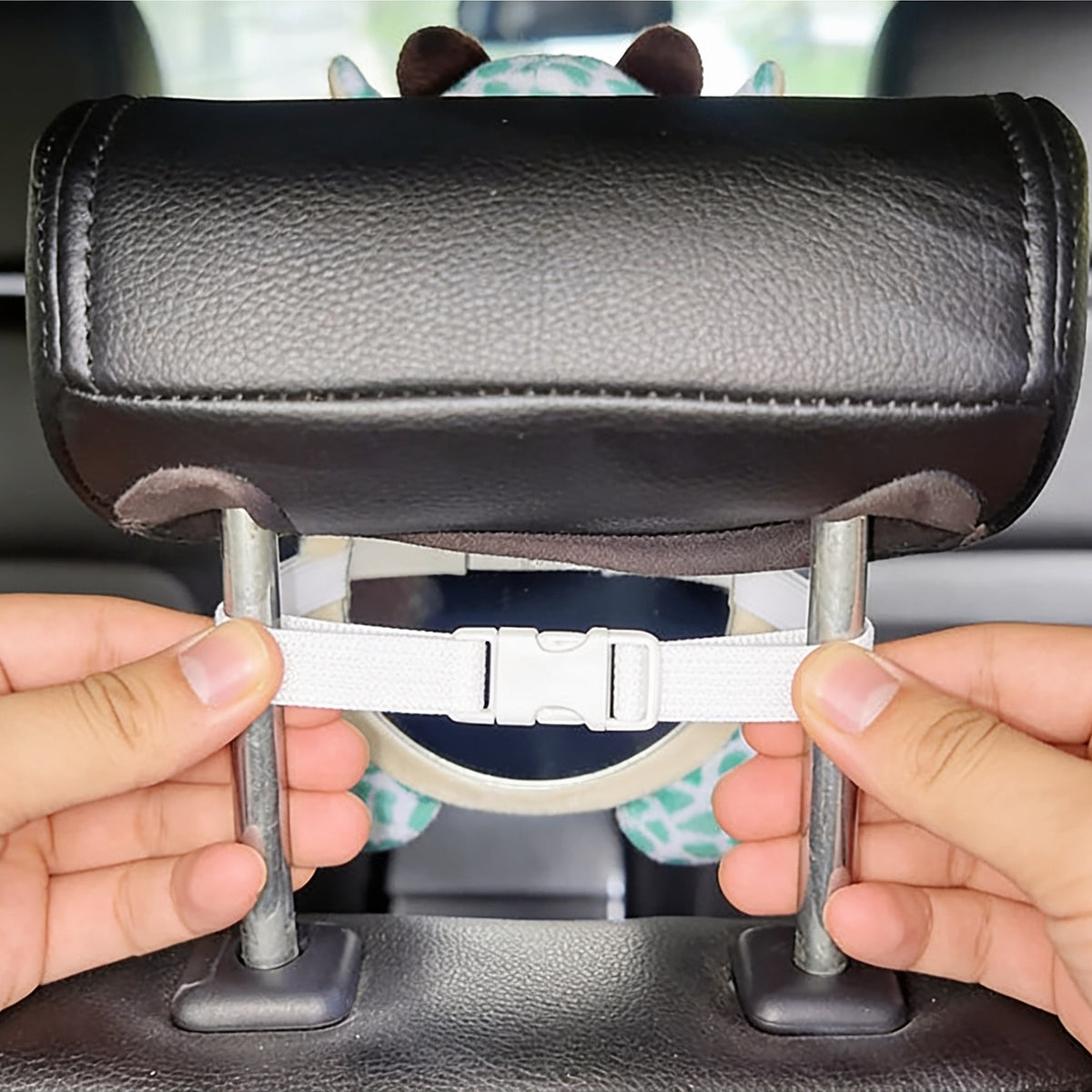 Lumiwee Glance back seat baby car mirror: buckling the mirror strap around the headrest posts