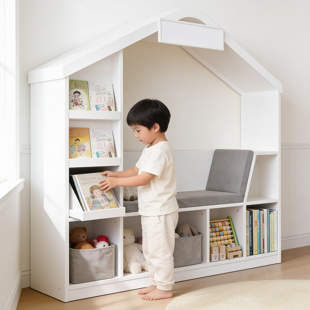 Lumiwee Hazel white kids bookcase with reading nook: child putting a picture book back on a face-out tier