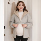 Lumiwee Hearth babywearing maternity jacket: zipping the jacket up over a pregnancy bump