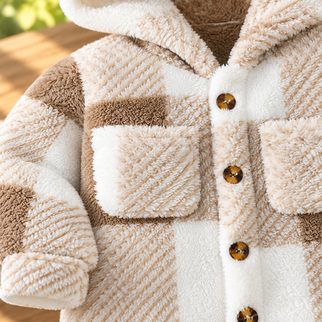 Close-up of Heather tan plaid plush fabric, chest flap pockets and front buttons
