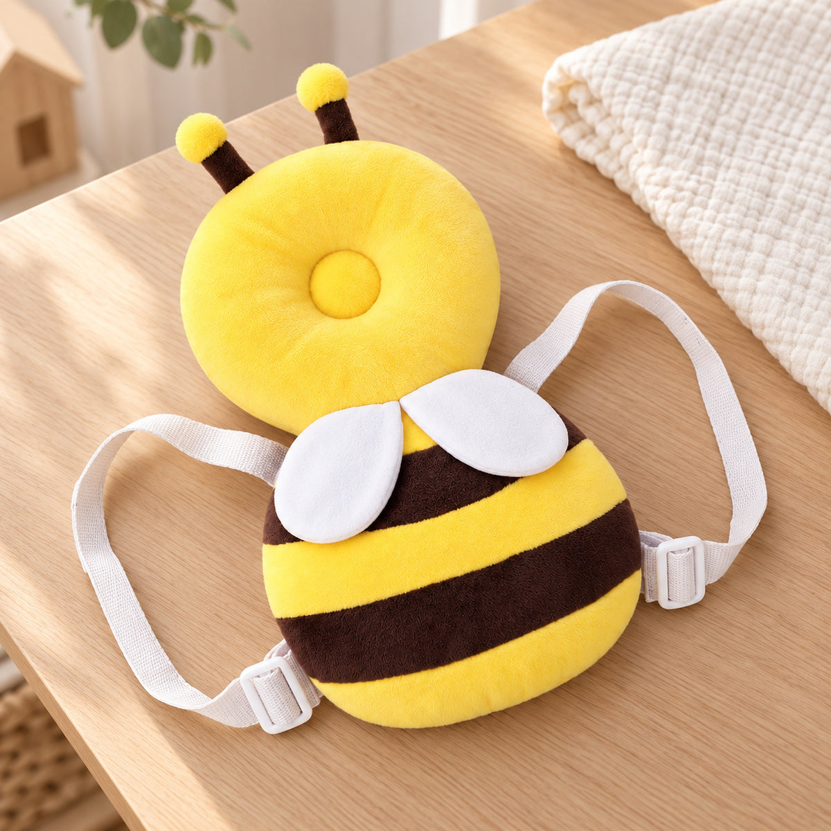Lumiwee Bee cushion backpack on a light oak table