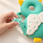 Adult hand adjusting the Owl cushion shoulder strap