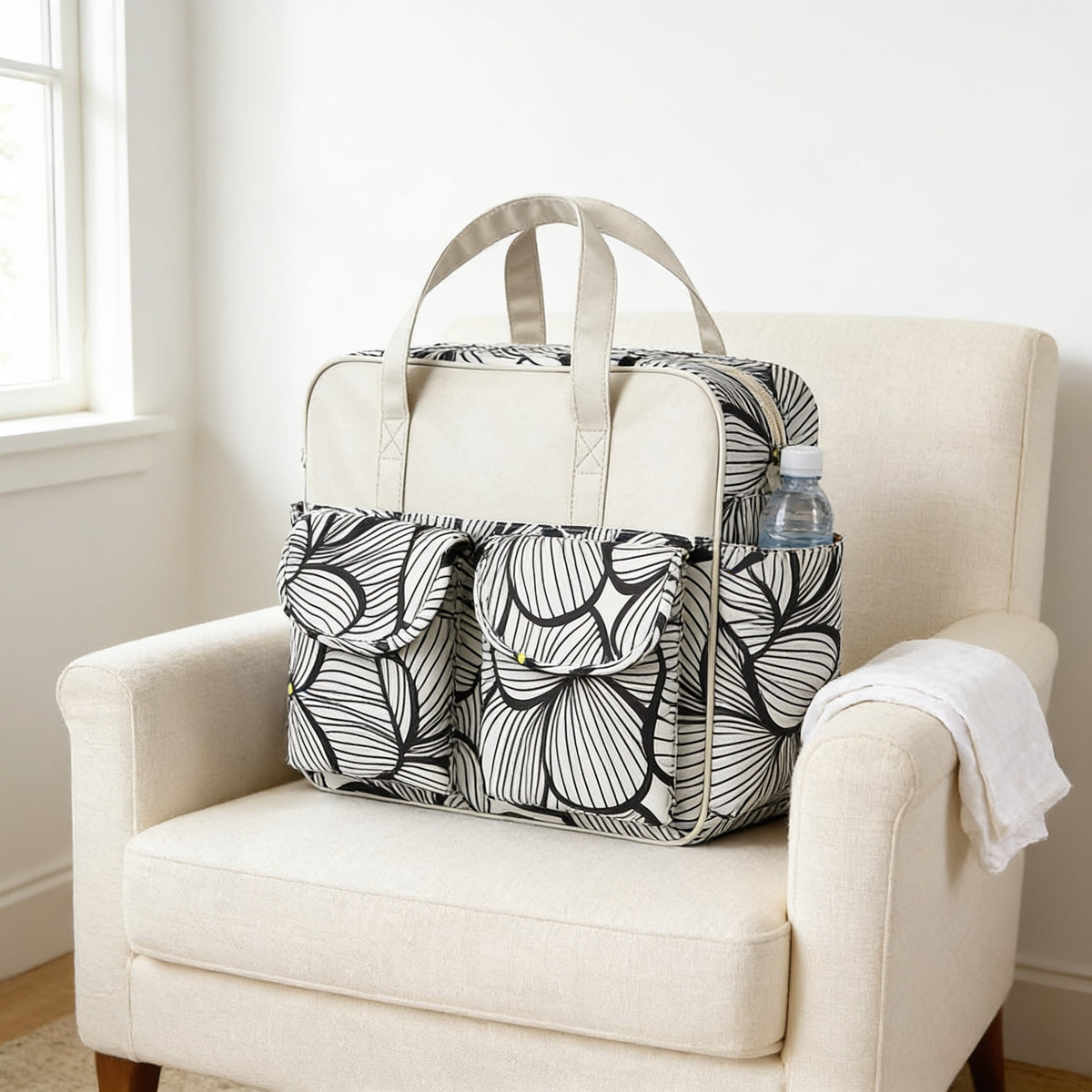 Lumiwee Lark diaper messenger bag, Black Petal option, in a bright room