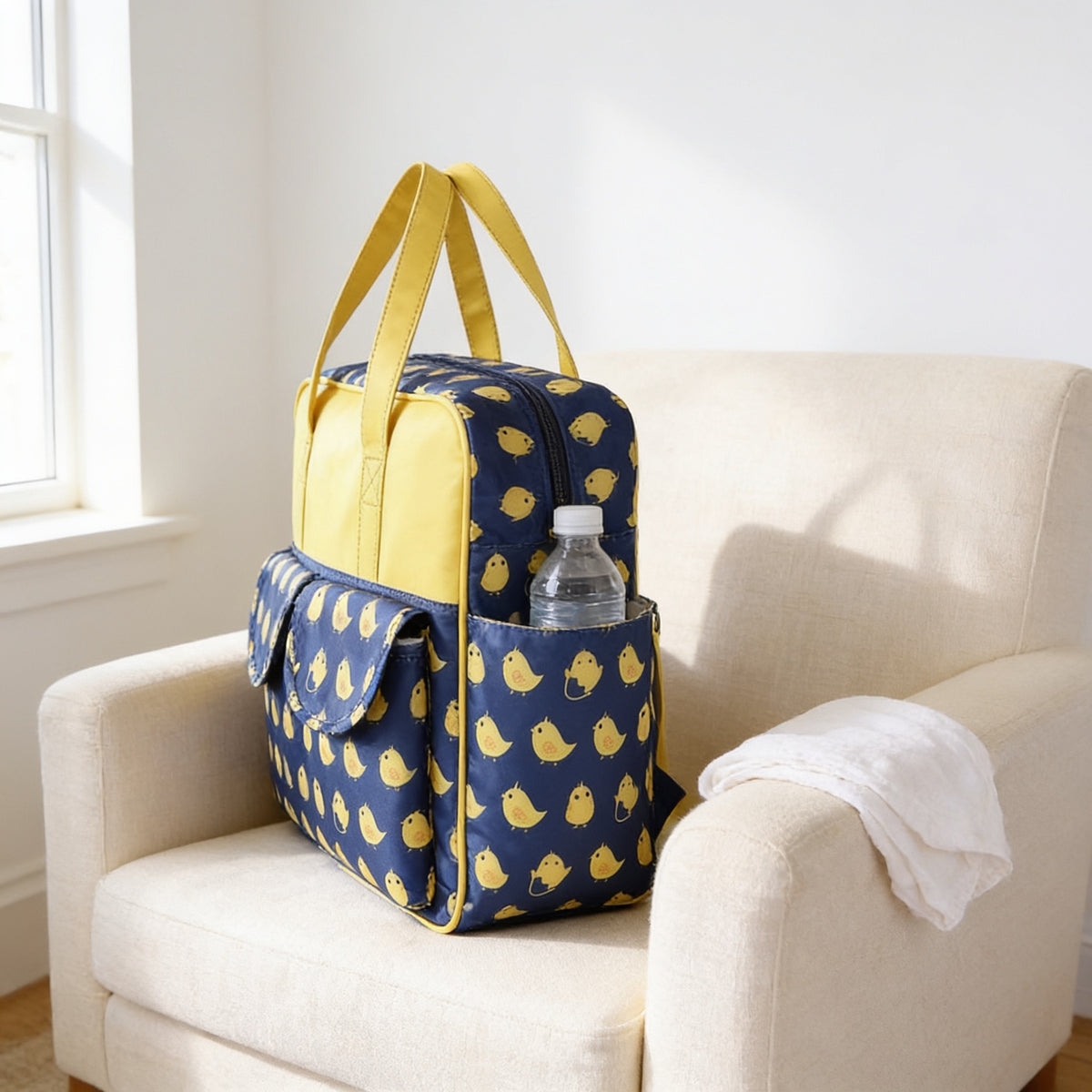 Lumiwee Lark diaper messenger bag, Lovely Chicken option, in a bright room