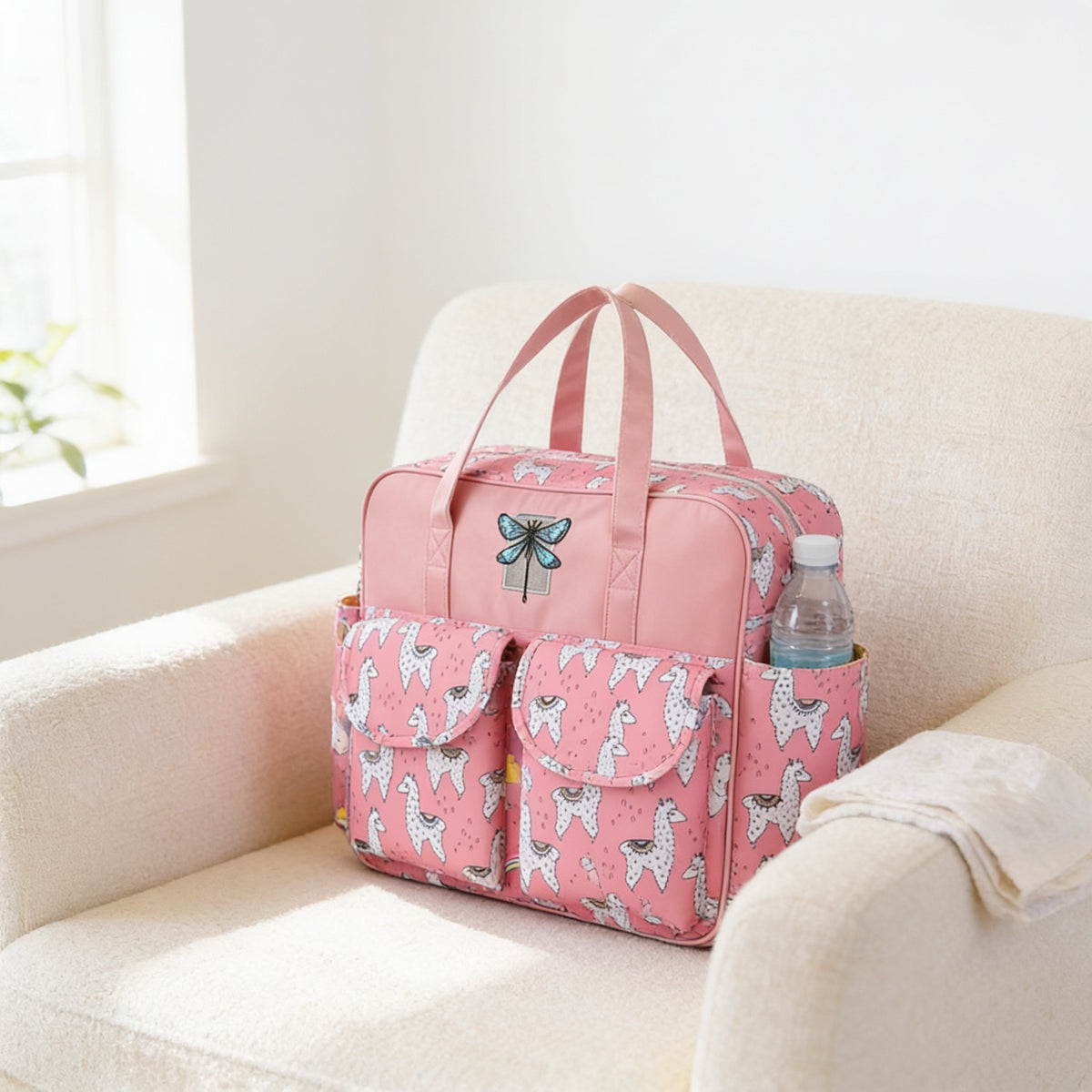 Lumiwee Lark diaper messenger bag, Pink Alpaca option, in a bright room