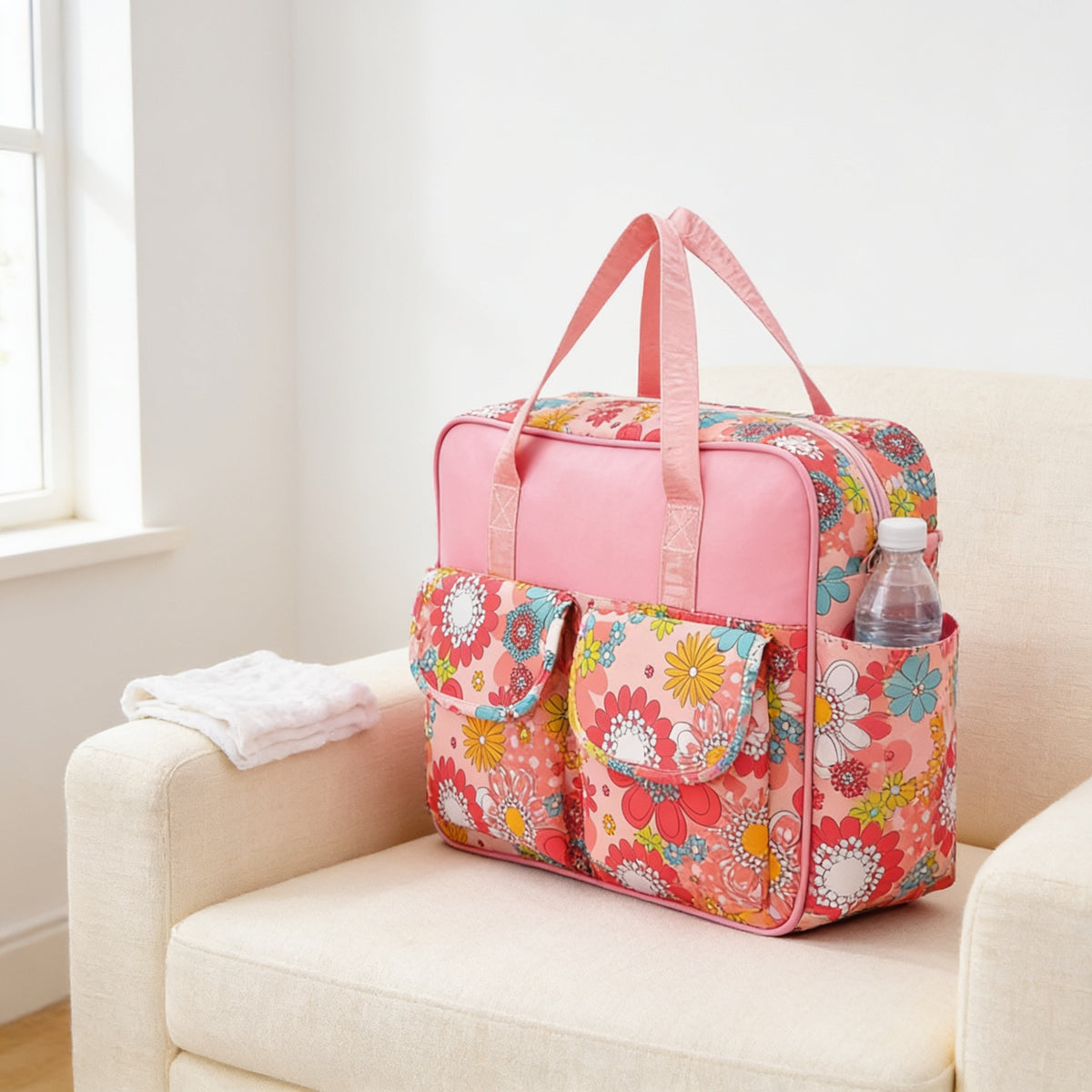 Lumiwee Lark diaper messenger bag, Pink Lady option, in a bright room