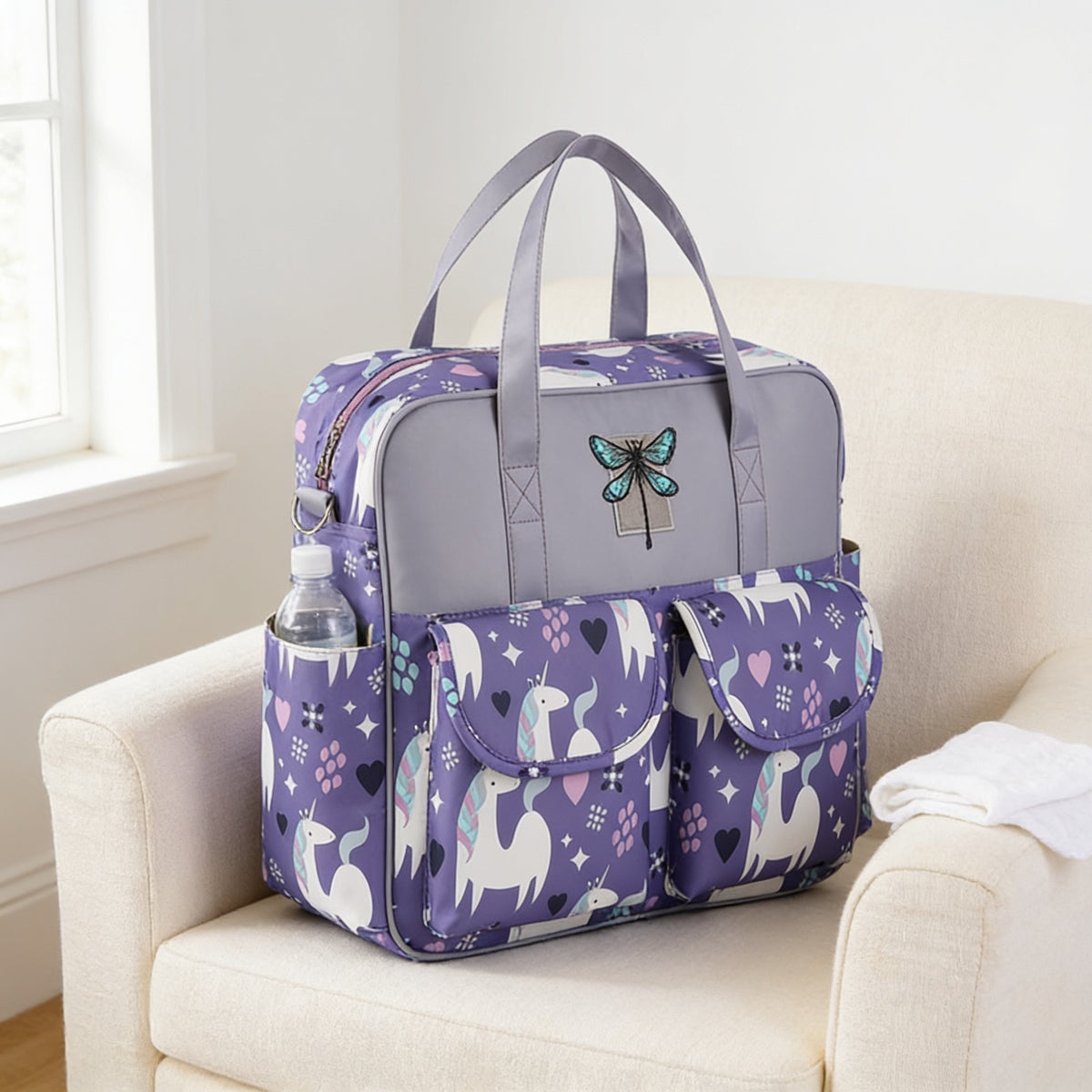 Lumiwee Lark diaper messenger bag, Purple Unicorn option, in a bright room