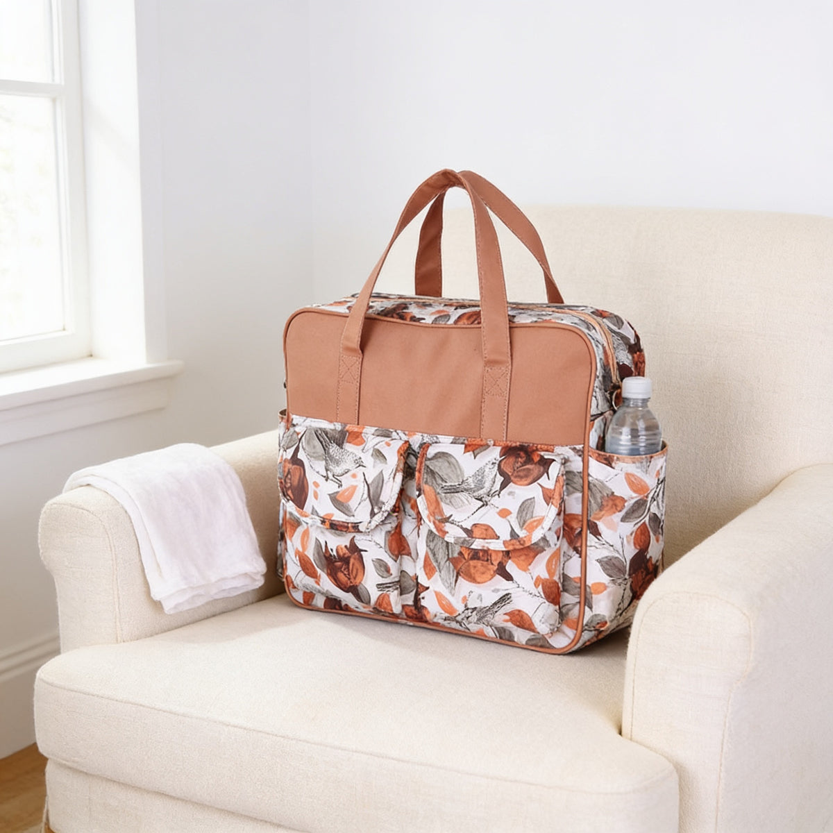 Lumiwee Lark diaper messenger bag, Red Rose option, in a bright room