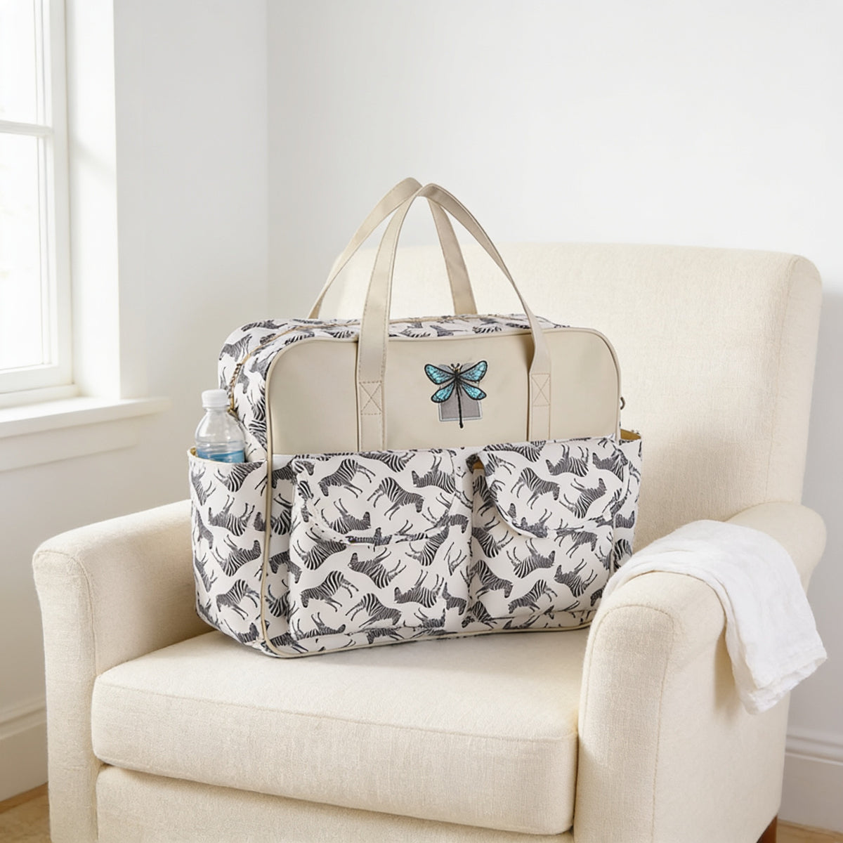 Lumiwee Lark diaper messenger bag, Zebra option, in a bright room