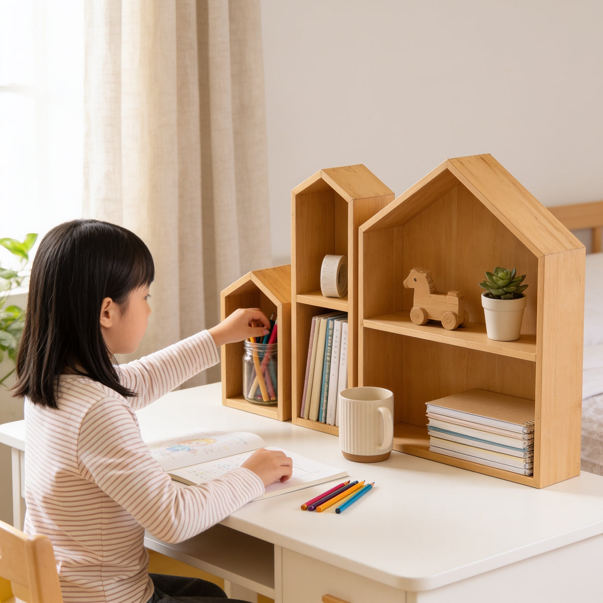 Lumiwee Linden wooden house desk organizer: child taking a pencil from the small house while doing homework
