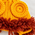 Close-up of Lion cap crochet ear and yarn mane