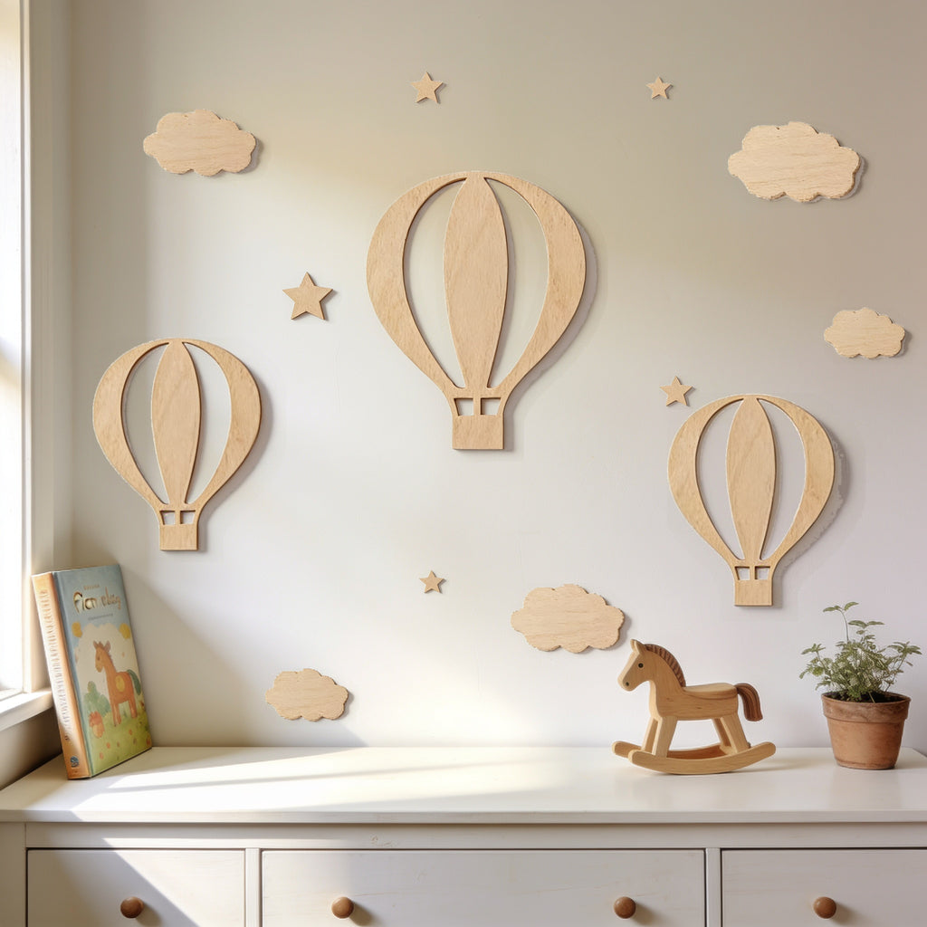 Lumiwee Lofty wooden hot air balloon wall decor: 13-piece wooden balloon, cloud and star set on a wall above a dresser