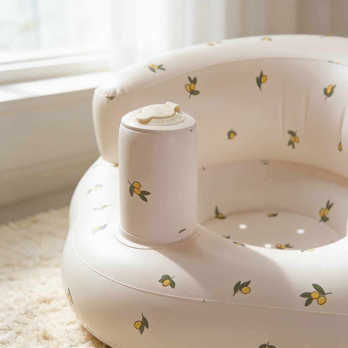 Lumiwee Mallow inflatable baby floor seat: close-up of the olive print and center post valve