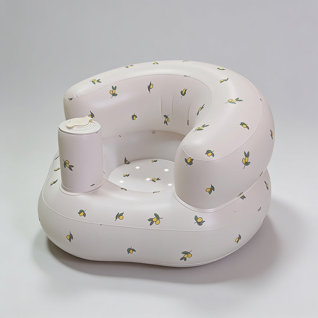 Lumiwee Mallow inflatable baby floor seat: cream inflatable baby floor seat on a plain background